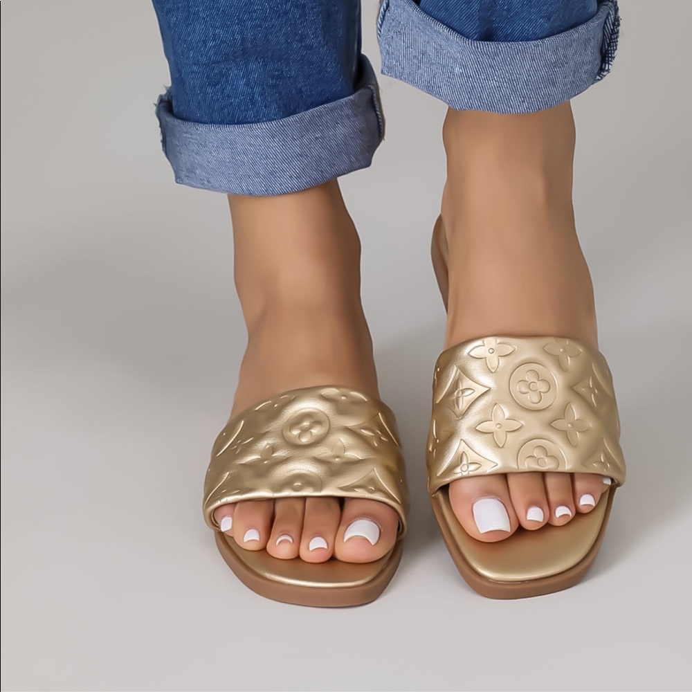 Gold sandals only worn once. Super comfortable. Size: 7